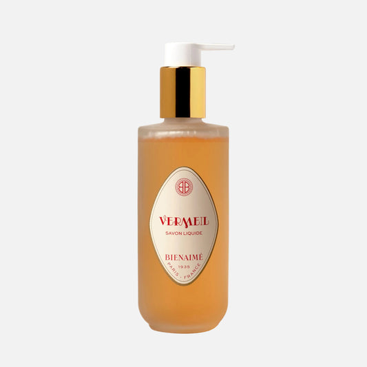 Bottle of 'Jours Heureux' soap with a pump on a light background
