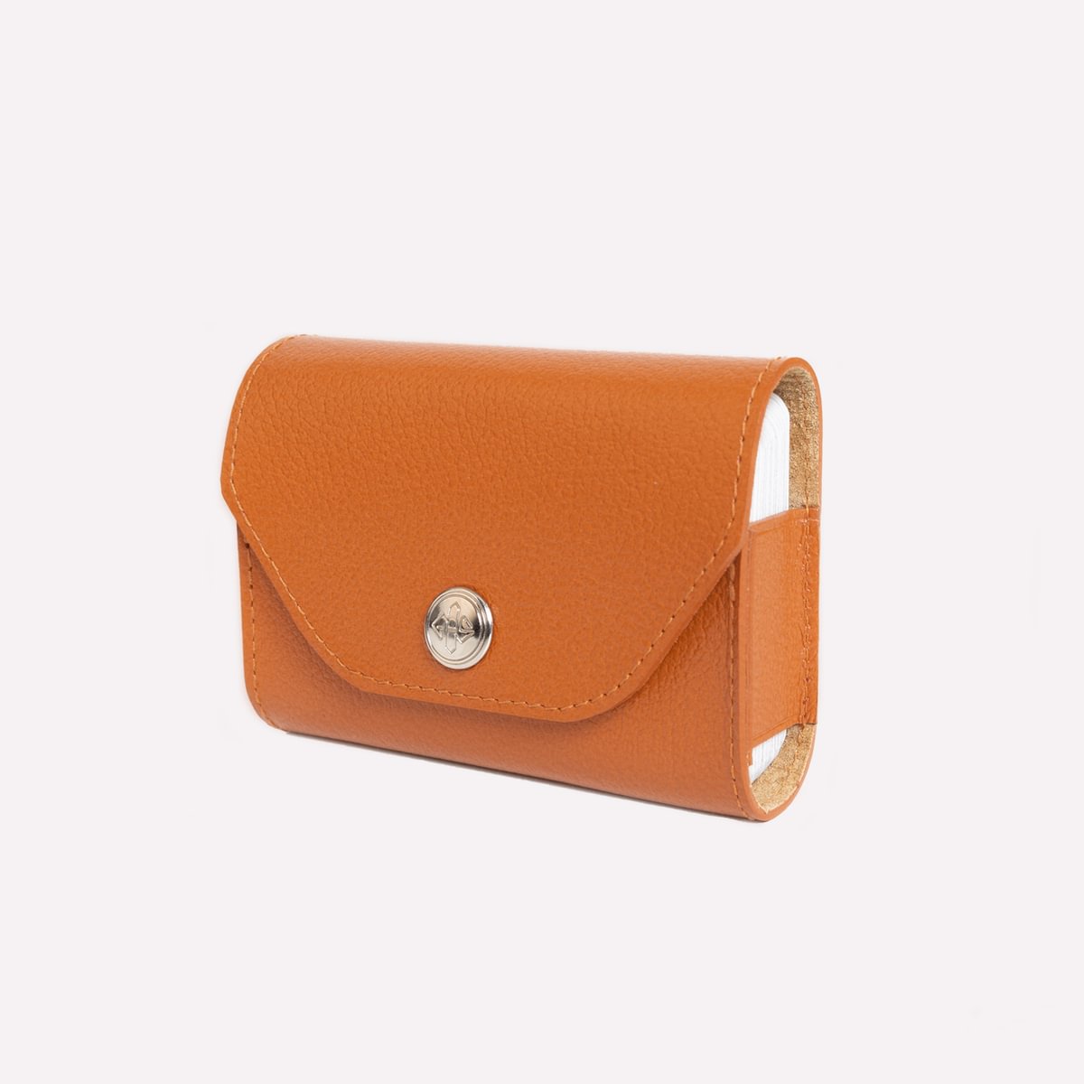 Orange leather wallet with a silver button on a white background