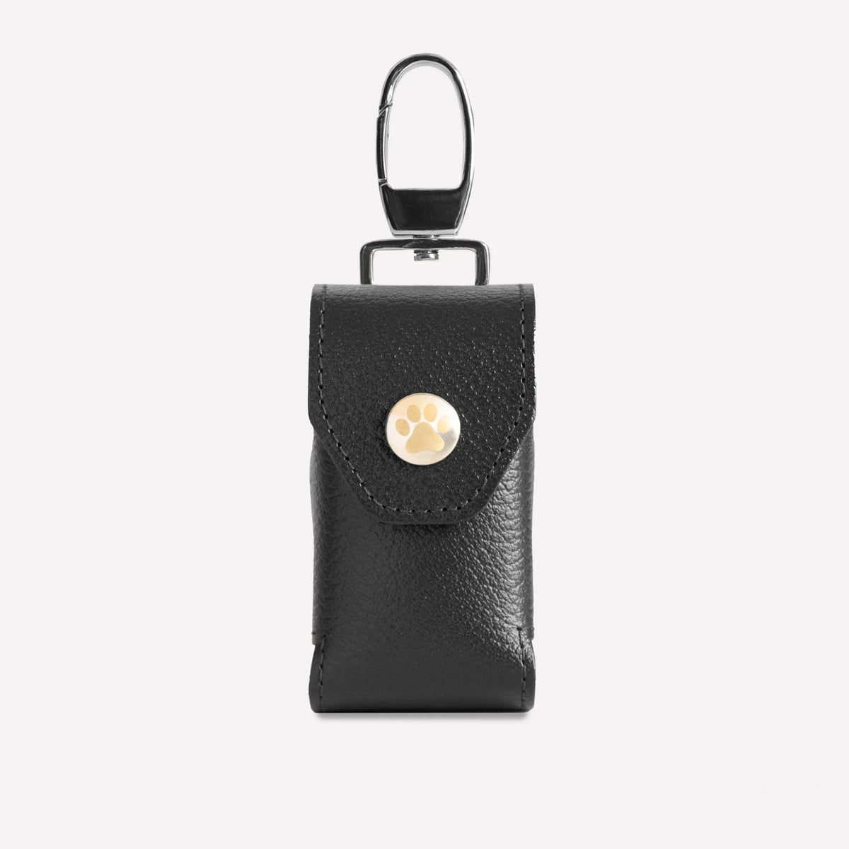 Black leather keychain pouch with a gold button on a white background