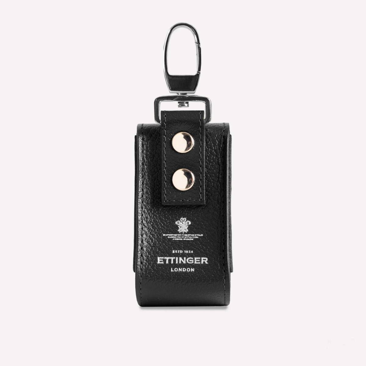 Black leather key case with 'Ettinger' branding on a white background
