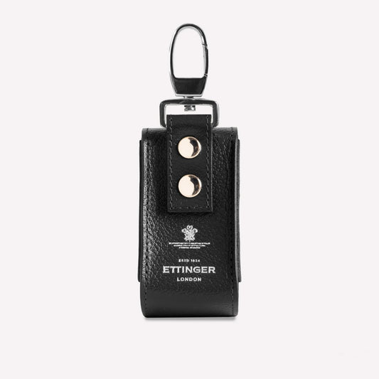 Black leather key case with 'Ettinger' branding on a white background