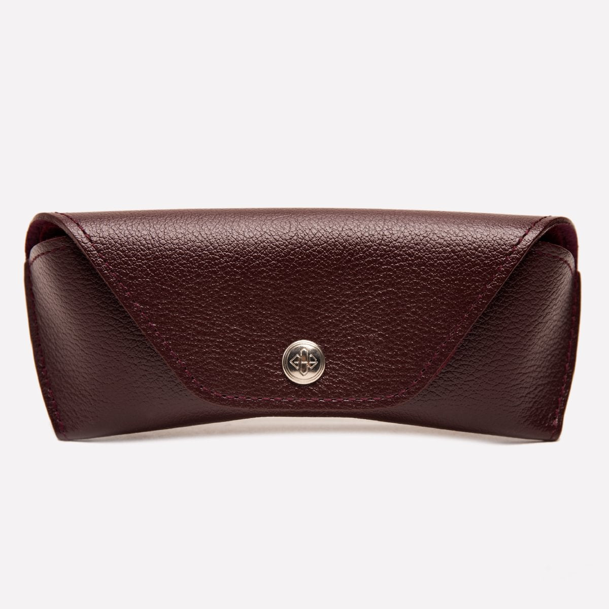 Brown leather clutch with a silver clasp on a white background