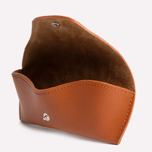 Brown leather case on a white background