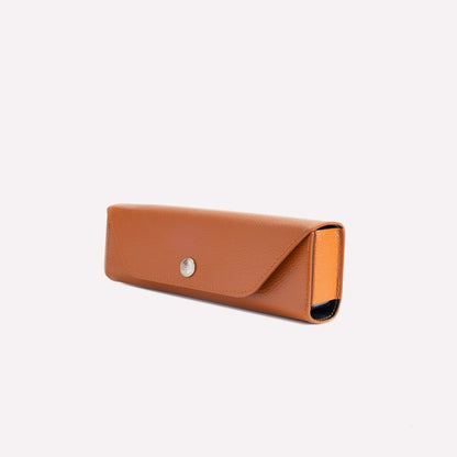Brown leather sunglasses case on a white background