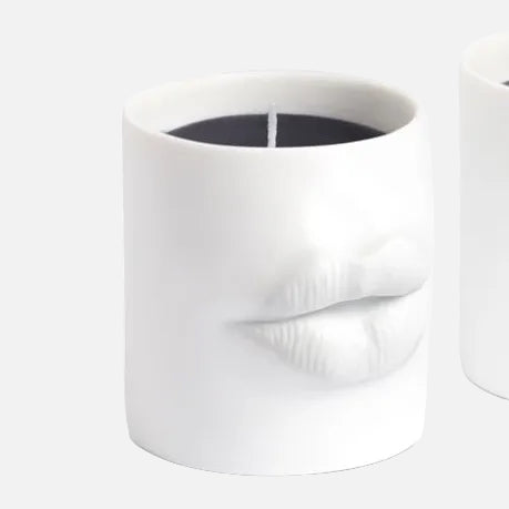 White ceramic candle with lips on white background
