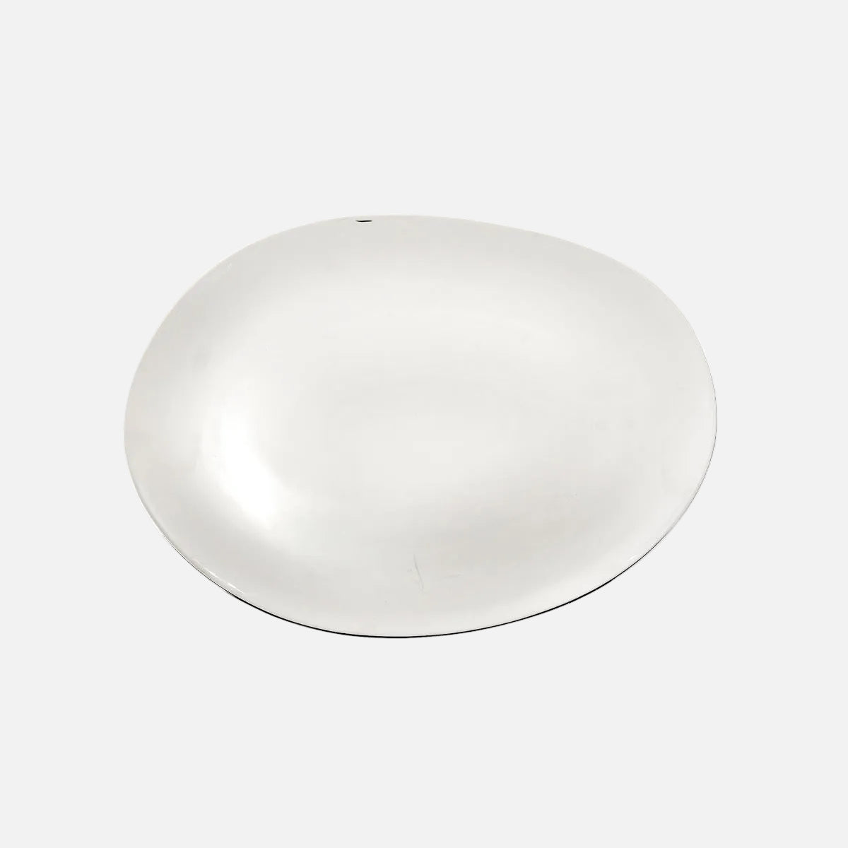 A minimalist, solid white oval tray or shallow dish with a smooth, glossy finish, shown from a top-down perspective on a clean white background.
