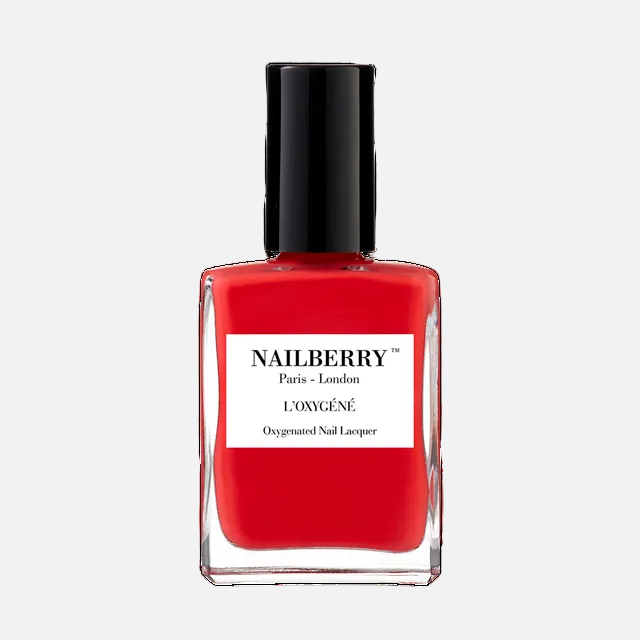 Red nail polish bottle with black cap on a white background, featuring the Nailberry brand.