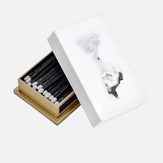 Decorative matchbox with matches on a white background