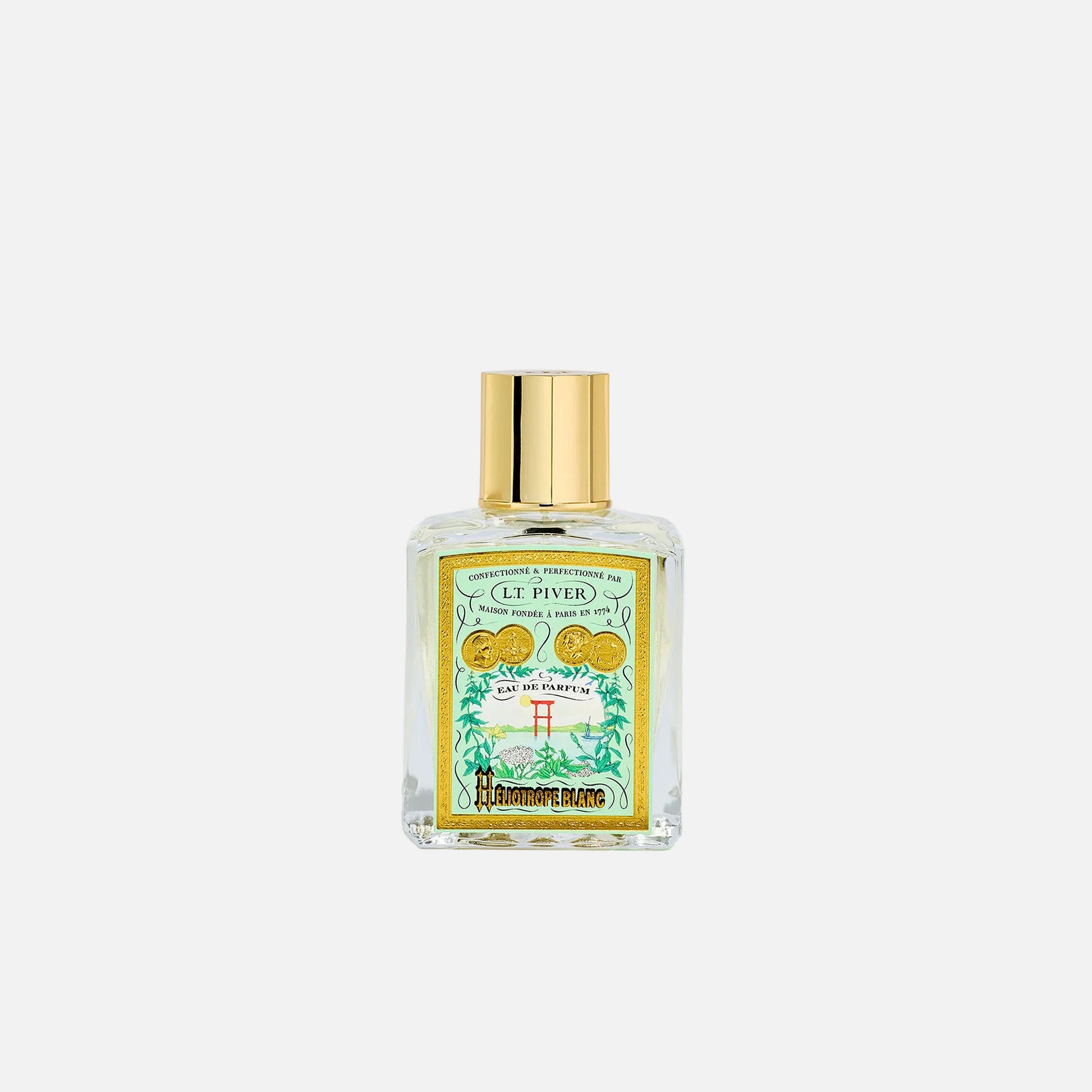 Perfume bottle with gold cap and decorative label on a white background