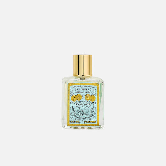 Perfume bottle with gold cap on a white background