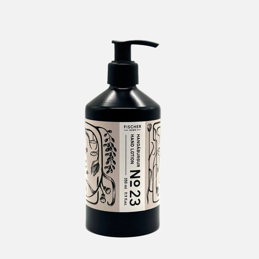 Hand lotion bottle with black pump and decorative label on a white background