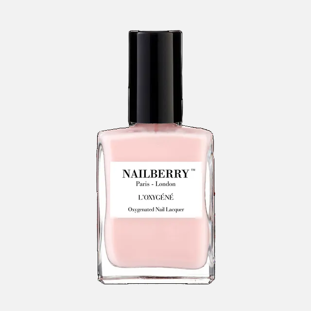 Pink nail polish bottle with black cap on a white background