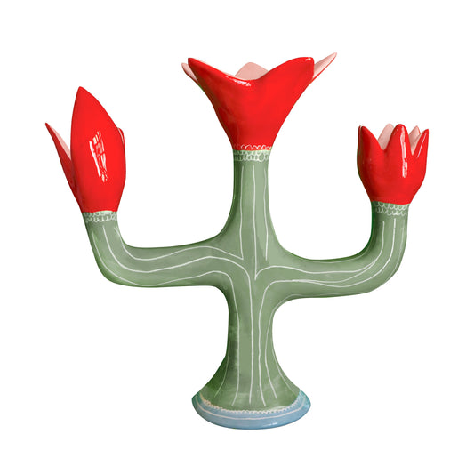 Ceramic cactus-shaped vase with red flower-like ends on a white background