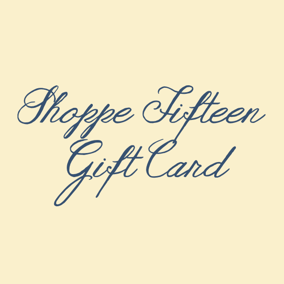 A gift card design with the text 'Shoppe Fifteen Gift Card' in dark blue cursive script on a pale cream background.