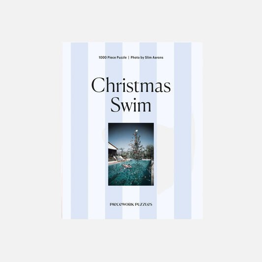 Puzzle box titled 'Christmas Swim' with a photo of a pool on the cover.