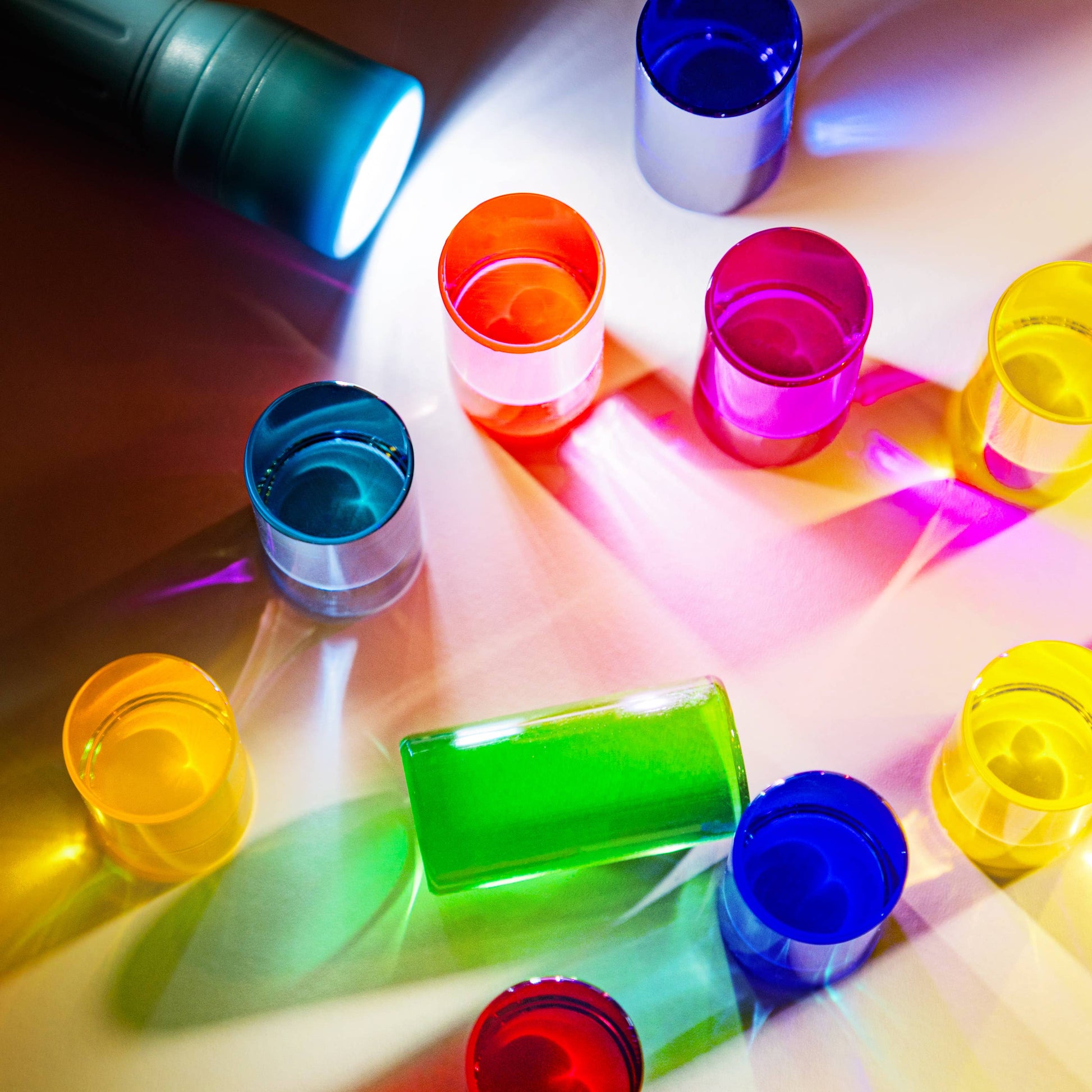Colorful blocks on a reflective surface with light effects