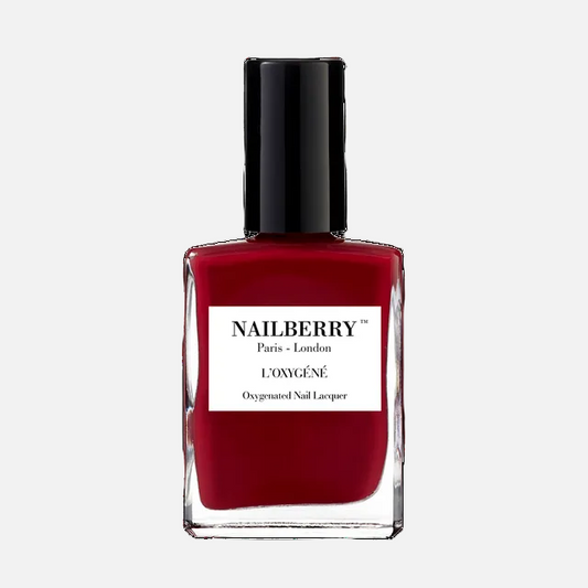 Red nail polish bottle with black cap on a white background, featuring the Nailberry brand.