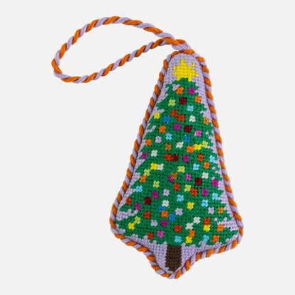 Colorful crocheted Christmas tree ornament with a star on a white background