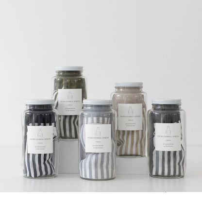 Set of jars with striped labels on a white background