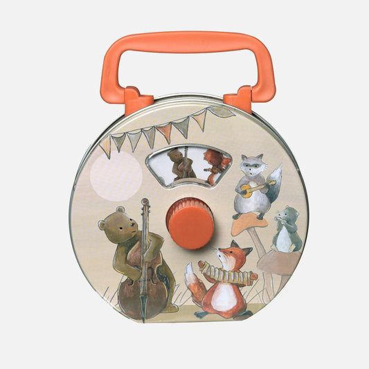 Round musical instrument toy with animal illustrations and an orange handle on a white background