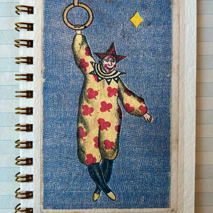 Notebook with a clown illustration on a blue background