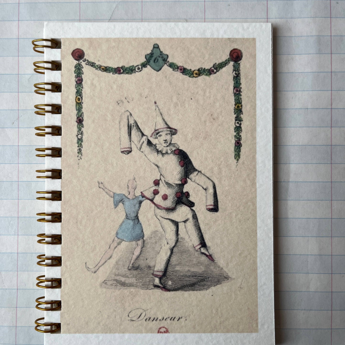 Notebook with vintage-style illustration on a checkered background