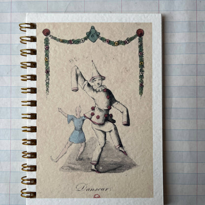 Notebook with vintage-style illustration on a checkered background