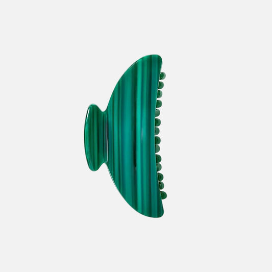 Green textured object on a white background