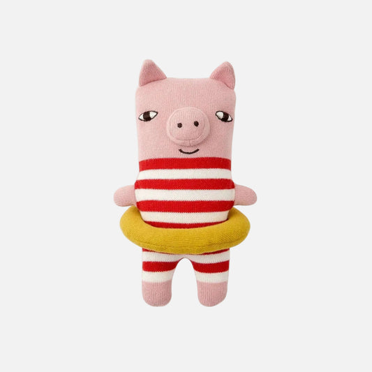 Plush toy pig wearing a red and white striped shirt with a yellow life preserver on a white background