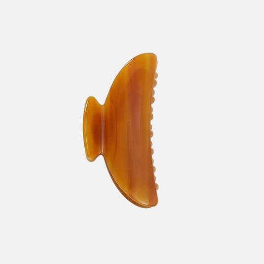 Brown hair clip on a white background