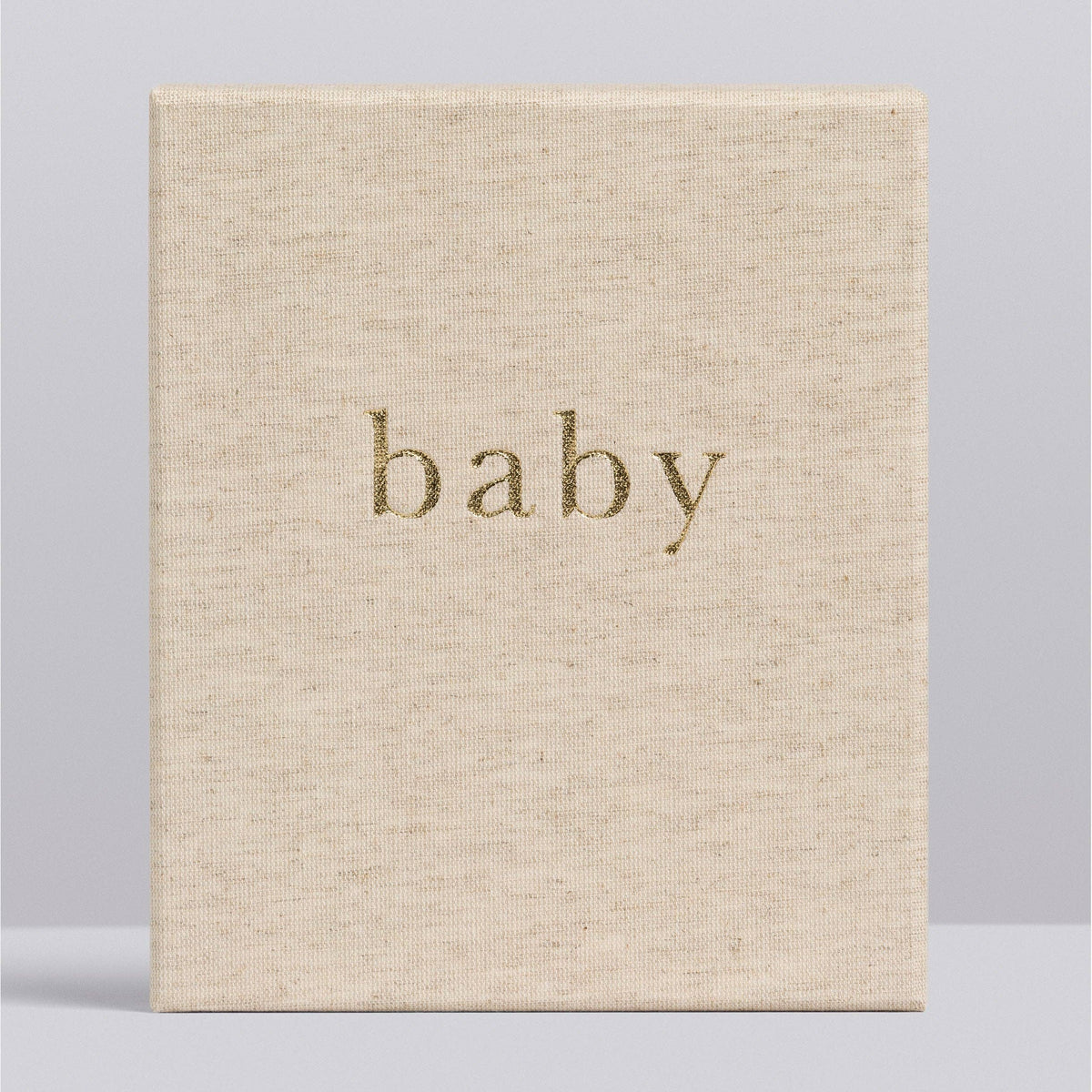 Beige book with 'baby' embossed on the cover against a light gray background