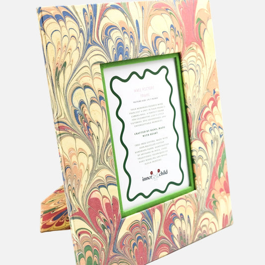 Marbled patterned product with a green frame and text on a white background