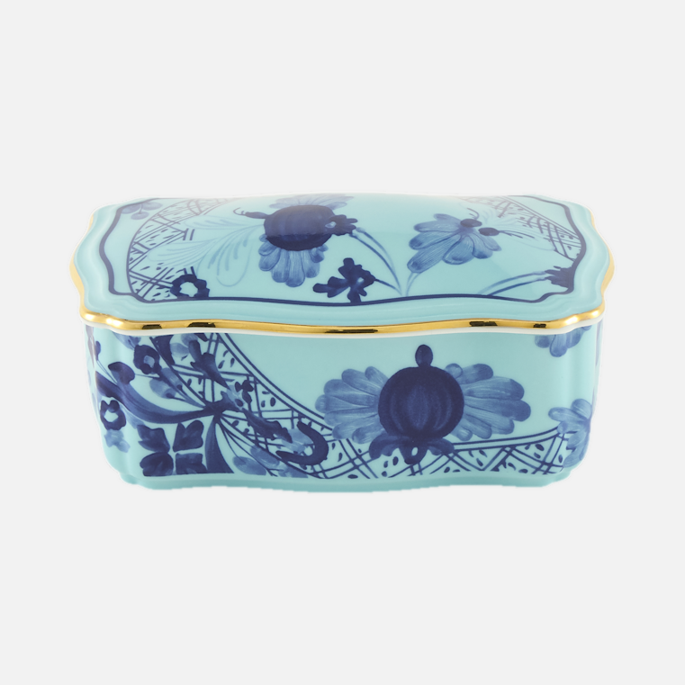 Oriente Italiano rectangular box with cover in Iris, a turquoise porcelain box with hand-painted blue florals and a gold rim.