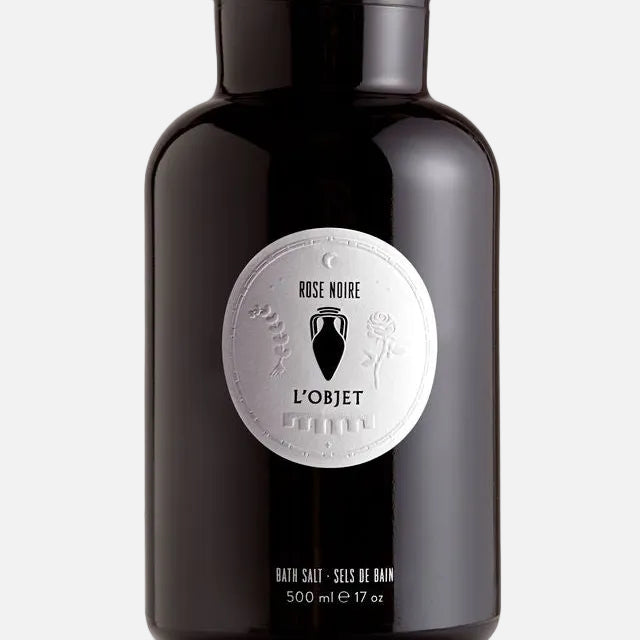 Black bottle of L'Objet Rose Noire bath salt on a white background