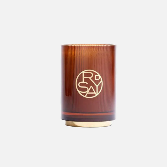 Brown candle with a logo on a white background