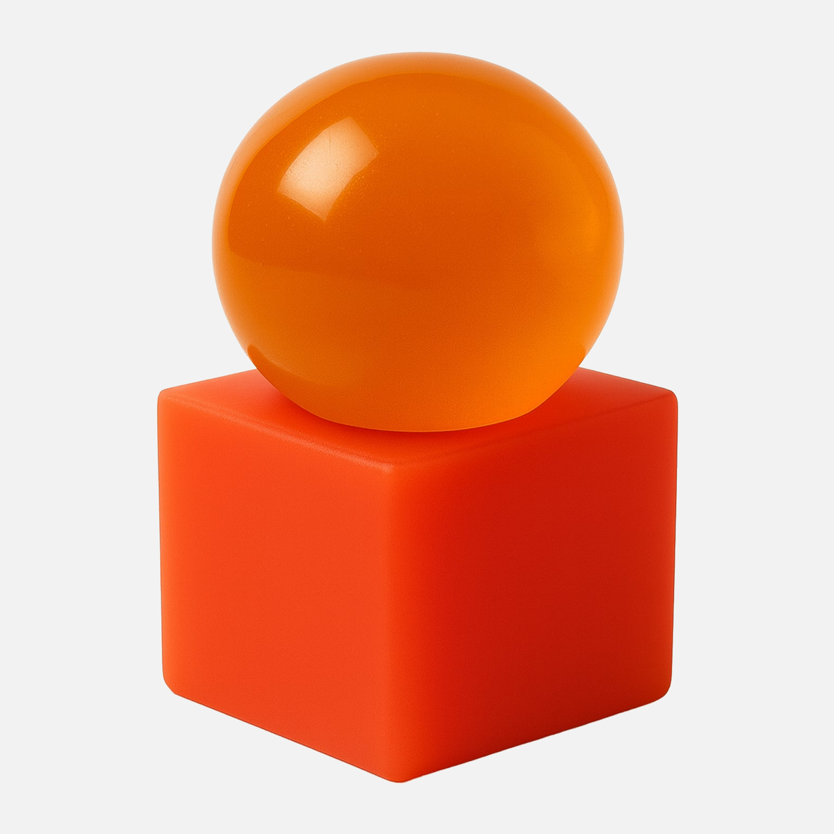 OBA Papaya soap, an orange translucent sphere on a red-orange resin base