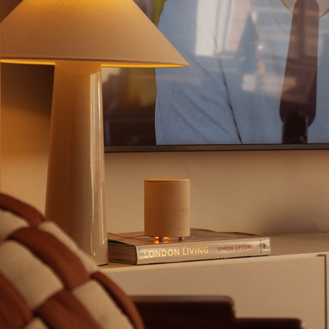 Droplet Wax Warmer glowing on a side table